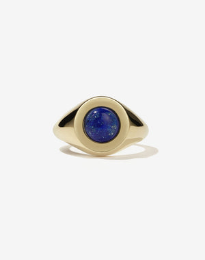 Gold stone set ring with lapis in centre